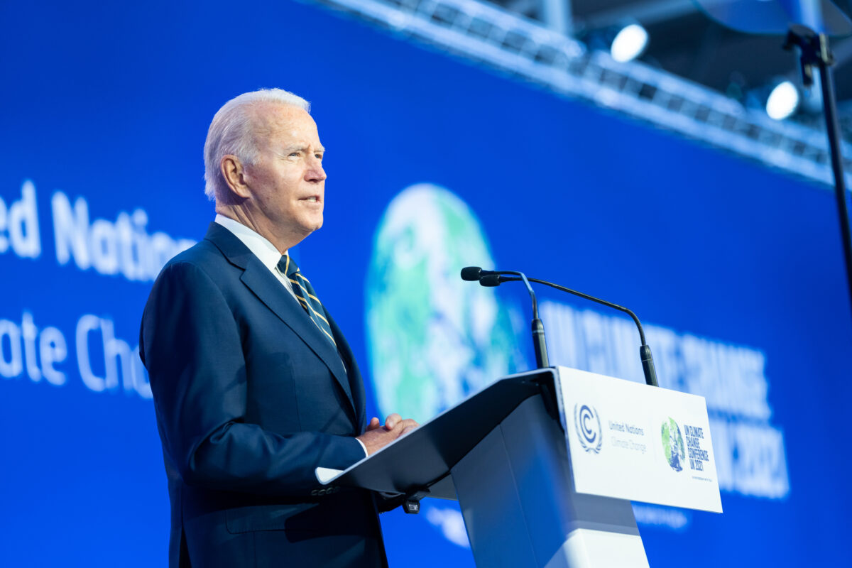 US President Joe Biden stands at the podium at COP26, 2021, the annual climate conference